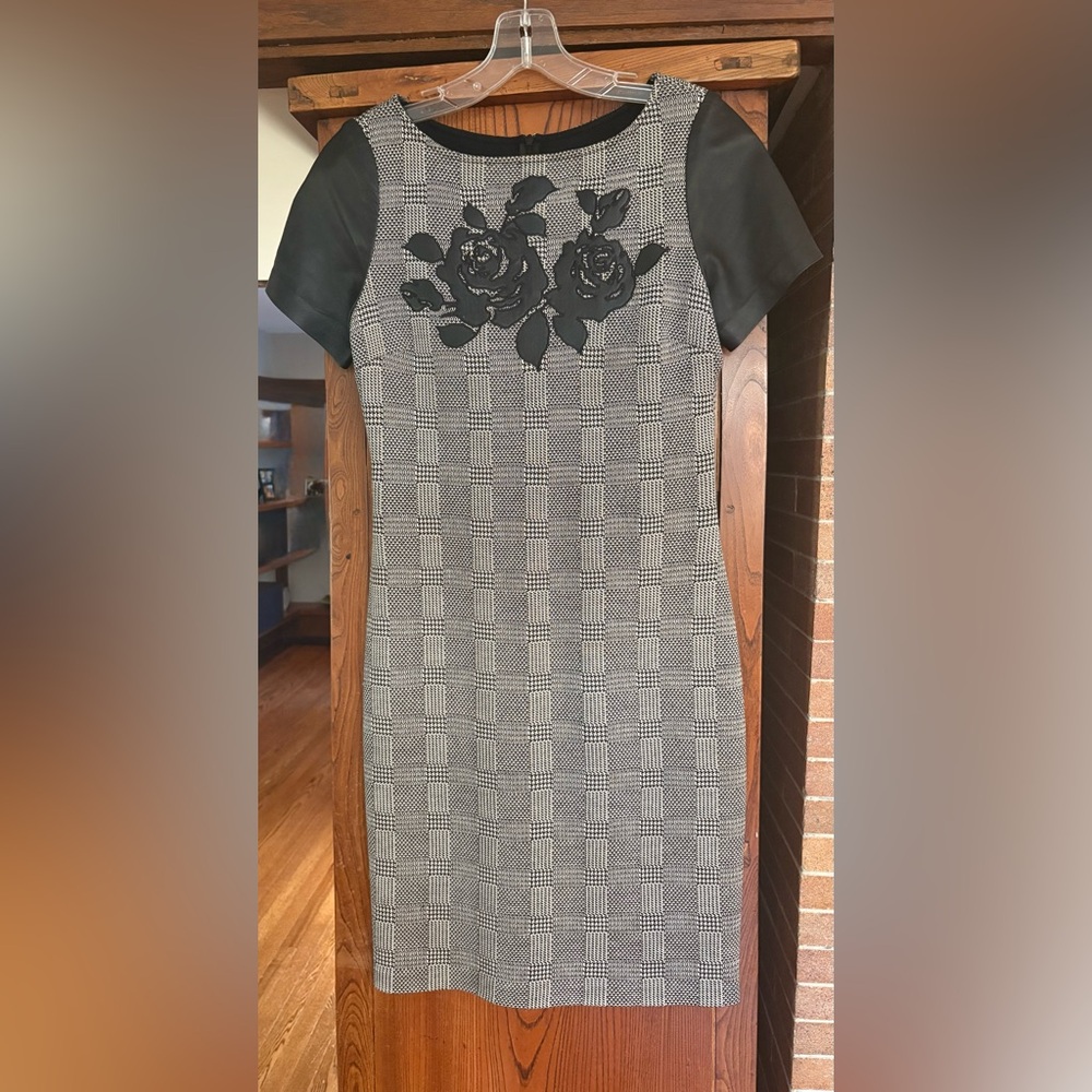 St. John short sleeve dress with black leather sleeves and leather appliqué